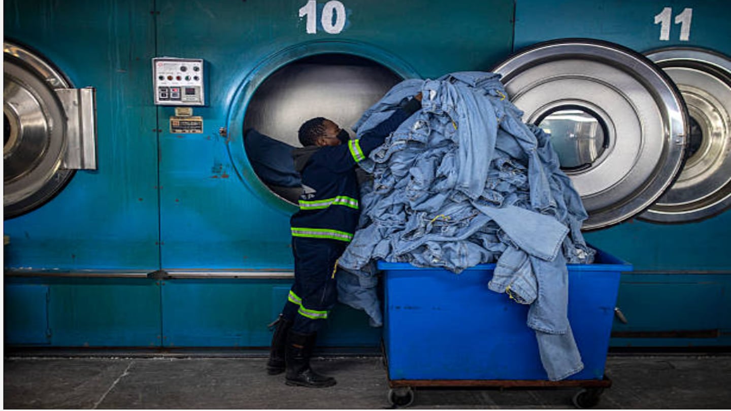 man loading large dryer